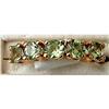 Image 1 : 14 K.GOLLD RING WITH GREEN GARNETS #1619753