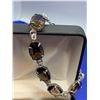 Image 1 : Natural Smokey Quartz 36.10 Carat Oval Cut Gemstone Bracelet, stamped 925 Silver certificate Value $