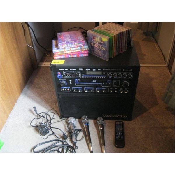 VOCOPRO GIGMAN KARAOKE MACHINE WITH MICROPHONES, CDs, ETC.