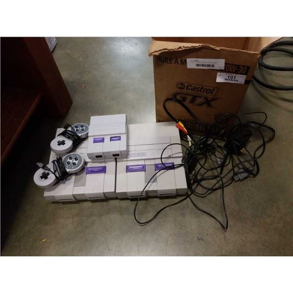 2 super nintendo consoles and mini console