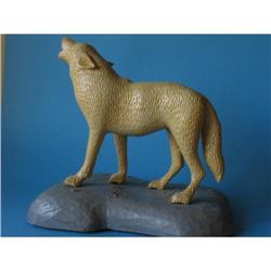 Painted wood carving of white wolf #1646173