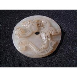 White jade carving featuring a dragon on top of#1640939