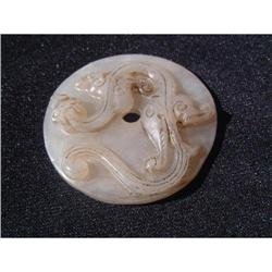 White jade carving featuring a dragon on top of#1640939