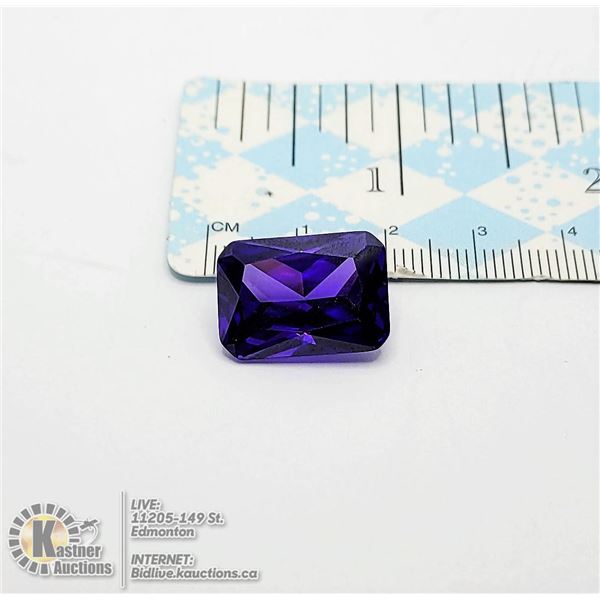 12)  EMERALD CUT 25.5 CT NATURAL PURPLE