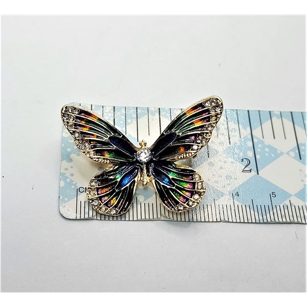 16)  GOLD TONE AND RAINBOW ENAMEL BUTTERFLY BROOCH WITH CRYSTAL ACCENTS.  JEWELRY