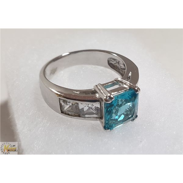 STERLING SILVER RING WITH LIGHT BLUE STONES AND 2