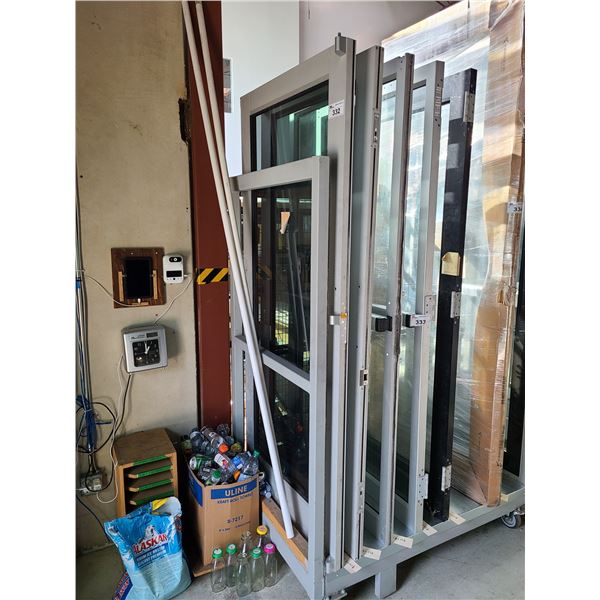 PAIR OF ALUMINUM FRAME AND GLASS COMMERCIAL DOUBLE DOORS 35" X 83.5"