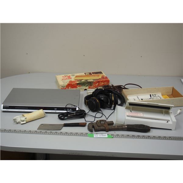 DVD Player, Headphones, Cords, Pipe Wrench, Small Meat Cleaver and Vacuum Sealer