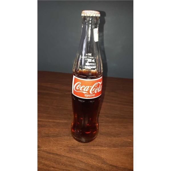 VINTAGE 300 ML COKE BOTTLE STILL SEALED WITH CAP