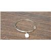 Image 1 : Adjustable bangle with a faceted White stone 2.5 inch diameter