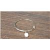 Image 1 : Adjustable bangle with a faceted White stone 2.5 inch diameter