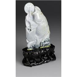 CHINESE CARVED JADE HARDSTONE CARP AMID WAVES