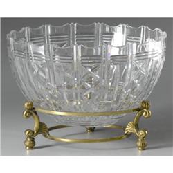 A LARGE CUT CRYSTAL BOWL ON BRASS STAND