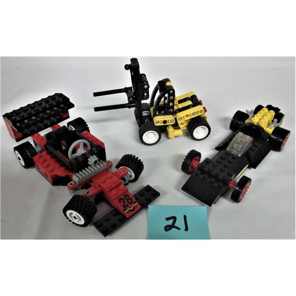 3 vintage Technic Lego sets - 1977 #491 Formula Racer, 1994 #8808 F1 racer, 2003 #8441 Fork Lift tru