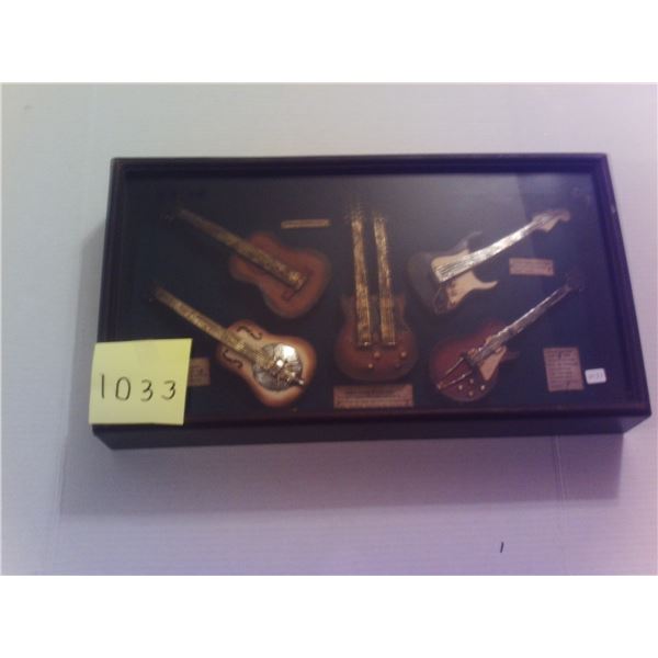 Glass case with guitars very old and heavy