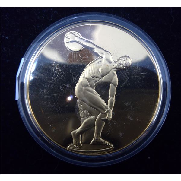 Diskobolos. (Athlete throwing discuss). From the Ancient Greece medals series. A beautiful gold-plat