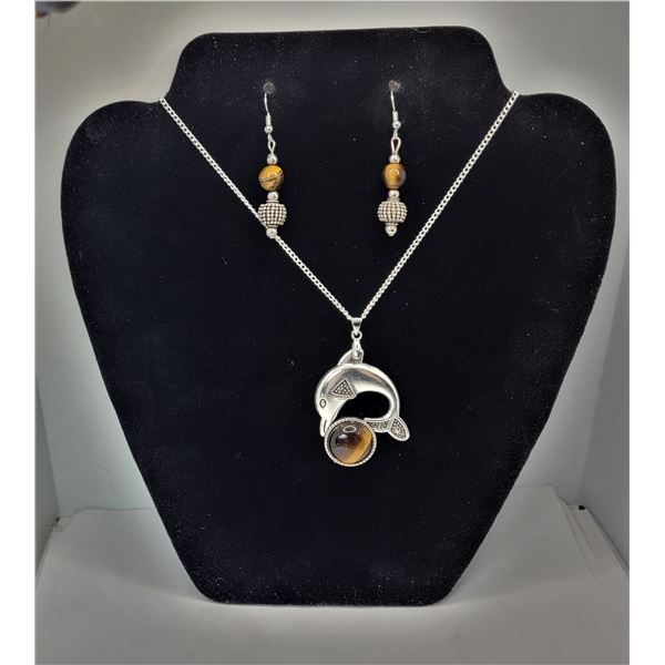 27)  TIBETAN SILVER DOLPHIN PLAYING WITH A