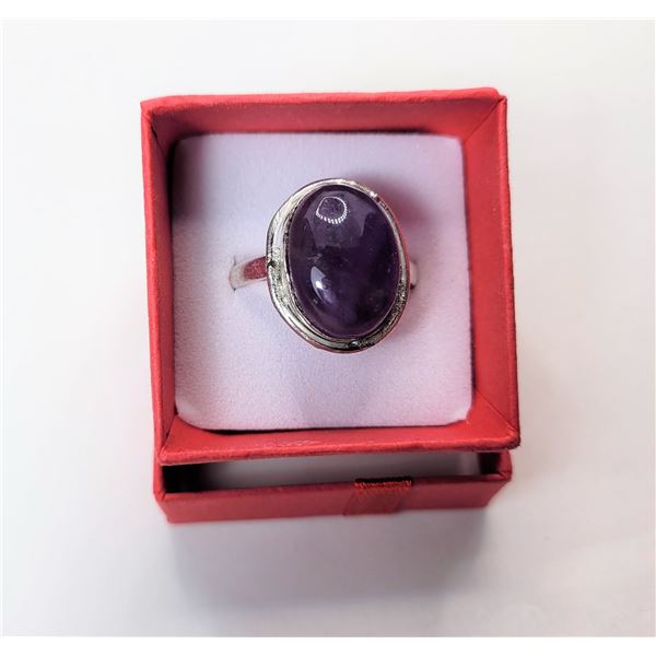 11)  OVAL PURPLE AMETHYST RING SET IN SILVER