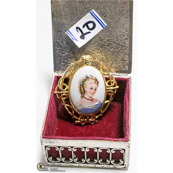 A PORCELAIN CAMEO BROOCH MADE IN FRANCE SIGNED.