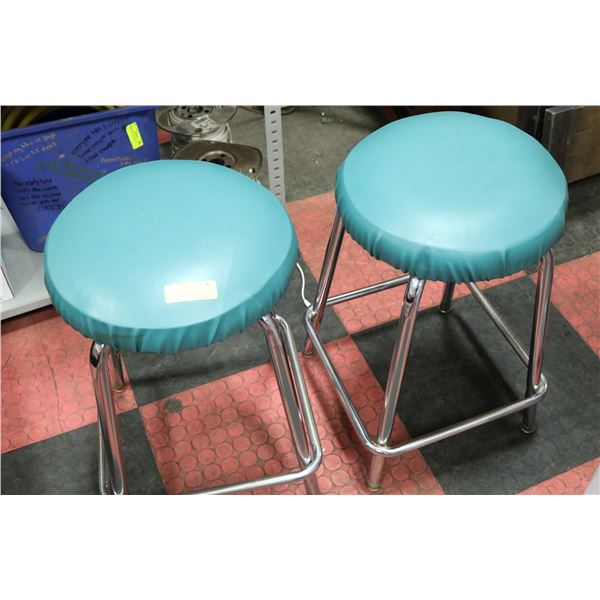 A PAIR OF UPHOLSTERED CHROME STOOL