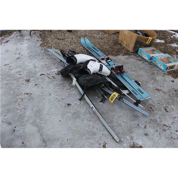 2 SETS OF SKIS, 7 POLES, 2 BOOTS SIZE M