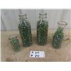 Image 1 : 4 Milk Bottles Full of Marbles