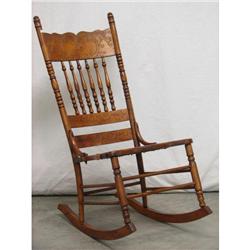 Oak Carved Spindle Cane-seat Rocking Chair