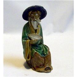 Chinese Mud Man With Fan #1677762