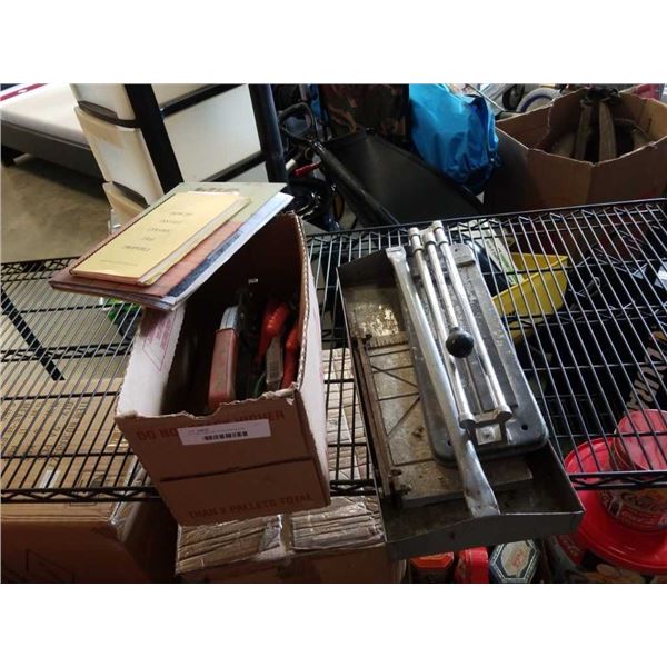 Box and metal tray of tile working tools