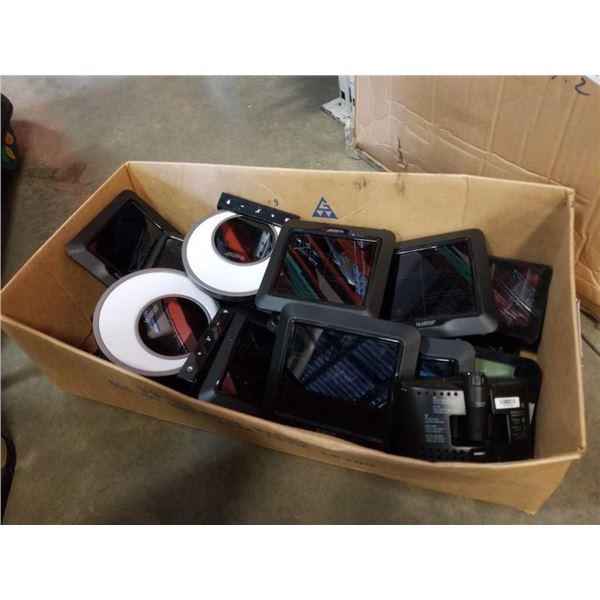 Box of store returned weather stations and electronics