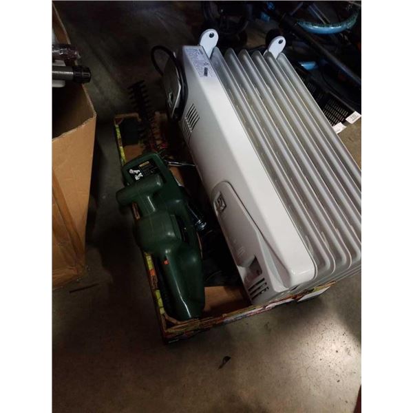 Box of tools with hedger, vacuum and oil heater