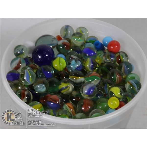 CONTAINER OF MARBLES FROM THE 1960'S