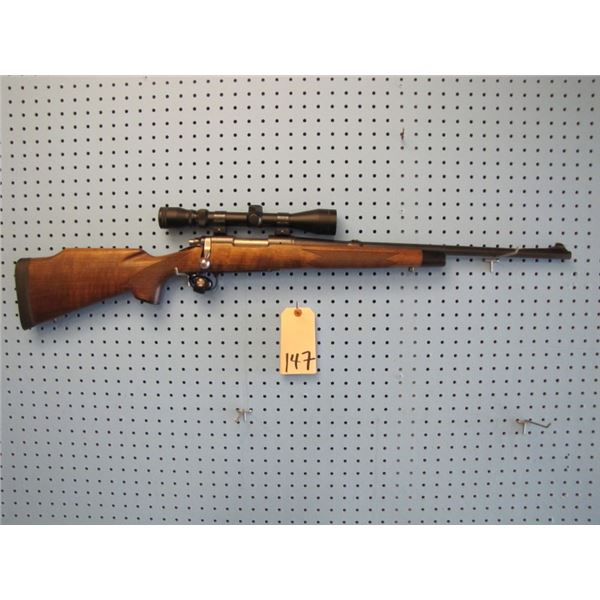 Remington Model 722, bolt action, 257 Roberts AI, hinged floor plate, in Remington model 700 stock, 