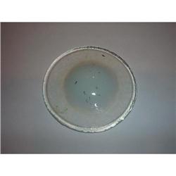 A round tile of pressed or molded opalescent #1672472