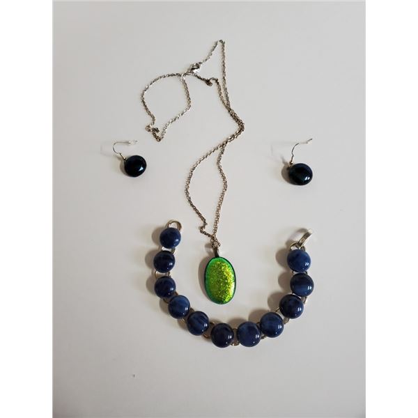 Pendant in dichroic glass, earrings and bracelet are indigo blue glass