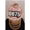 Image 1 : Porcelain And Bean Bag Doll In Wicker Crib