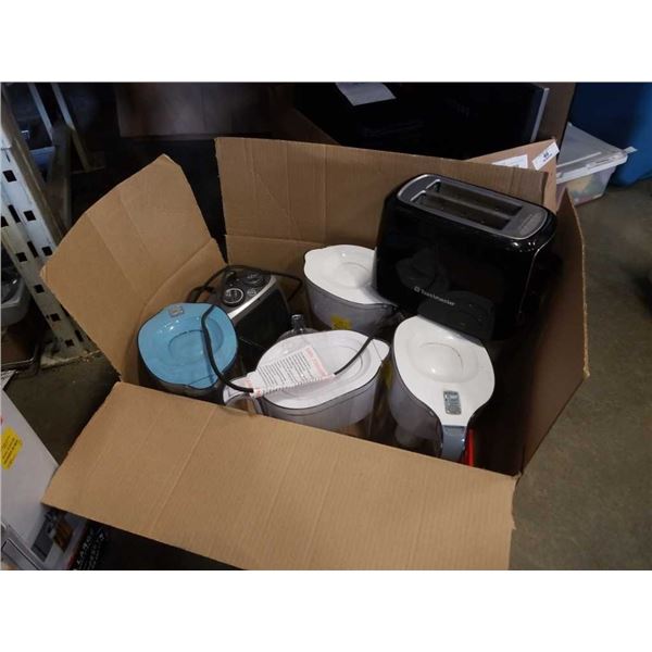 Box of store return water jugs/filters and toaster
