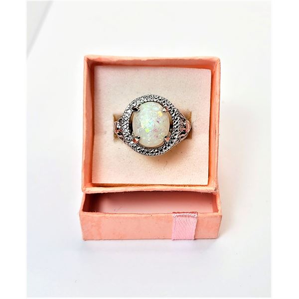 17)  LAB CREATED WHITE FIRE OPAL RING SET IN 925 STAMPED SILVER WITH CLEAR CZ HALO AND FILAGREE OPEN