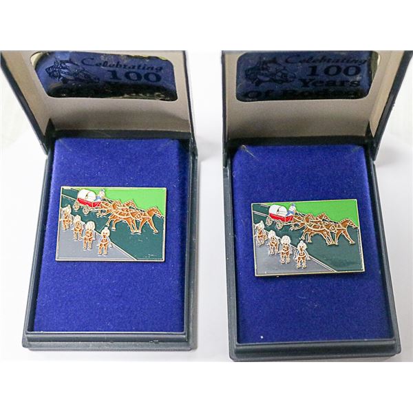 PAIR OF 100 YEARS OF CALGARY STAMPEDE PINS IN