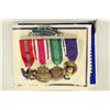Image 1 : MINI BAR OF 4 US MEDALS WITH RIBBONS AND PIN BACK