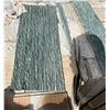 Image 1 : A pallet of green stone tiles