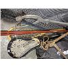 Image 2 : two pair of ski poles, a Lacrosse stick, 2 ice tongs