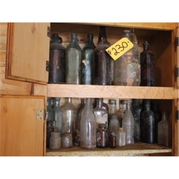 2 SHELVES OF GLASS BOTTLES