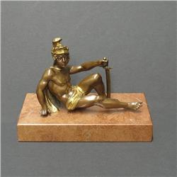 Miniature French bronze figure of a reclin