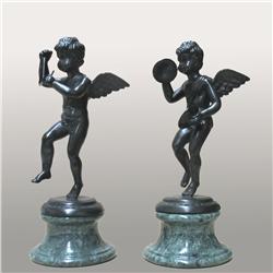 A pair of brass bronze finished cupid figu