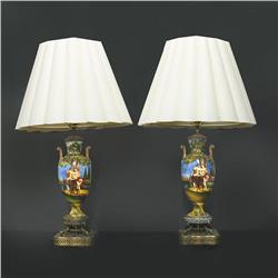 A pair of Maiolica pottery lamps in handle