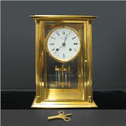 French carriage clock; brass case with bev