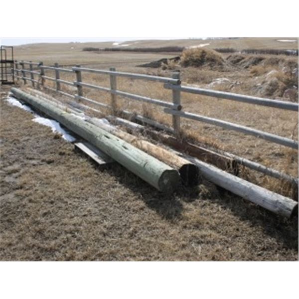 4 POWER POLES ON THE GROUND SOUTH OF HOPPER BINS