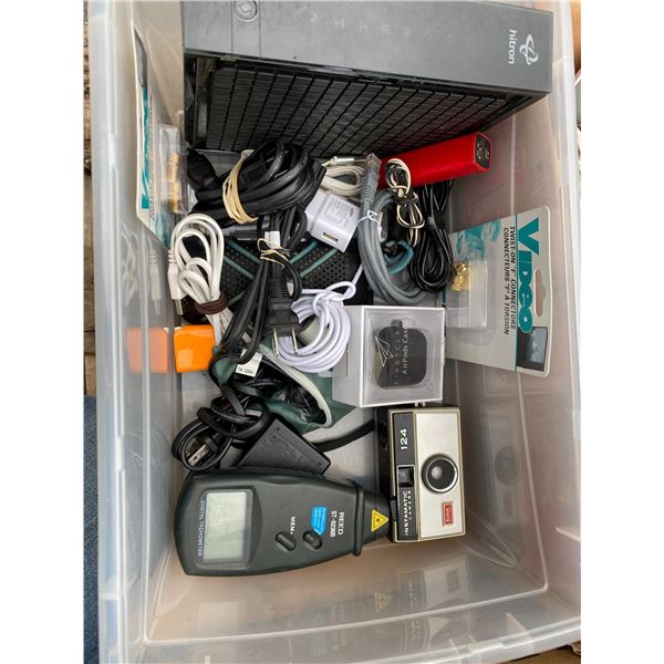 Bin of electronics and cords and camera
