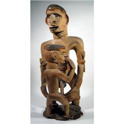 AN ASMAT ANCESTOR SCULPTURE,